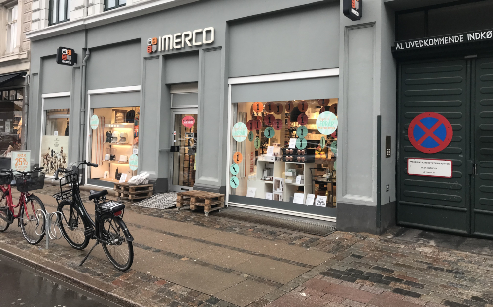 Imerco store front with bicycles in front of it